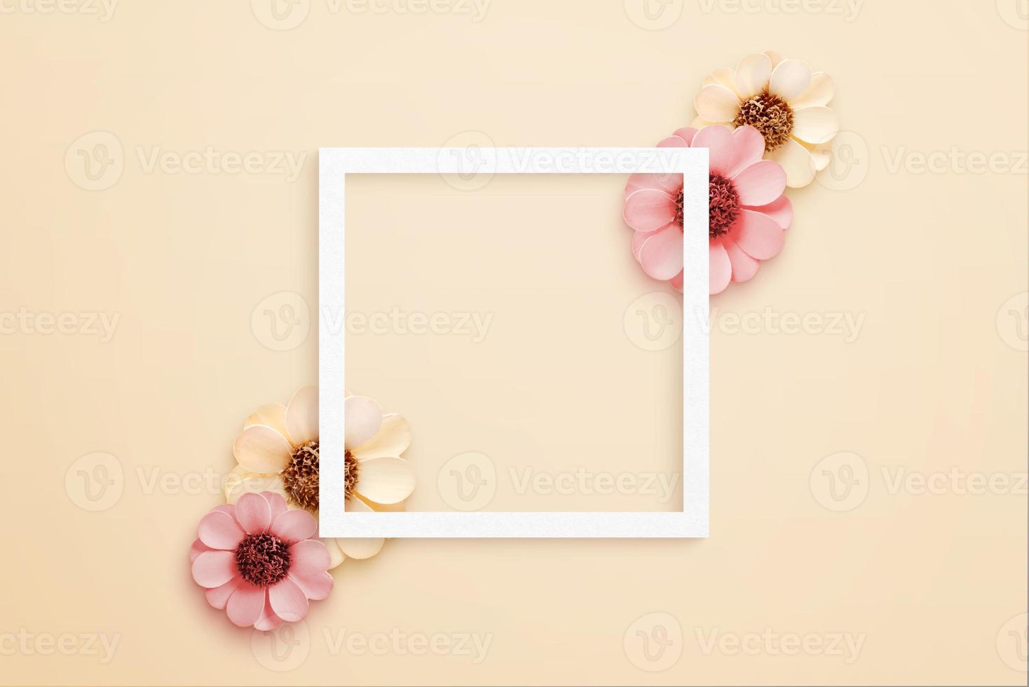 White paper square frame surrounded by spring flowers. Top view, flat lay composition photo