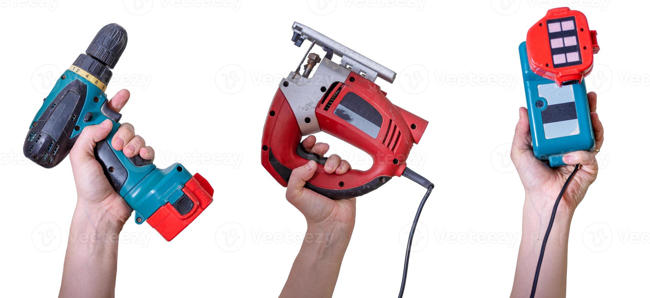 Hand tools. Hands holding construction tools isolated on white