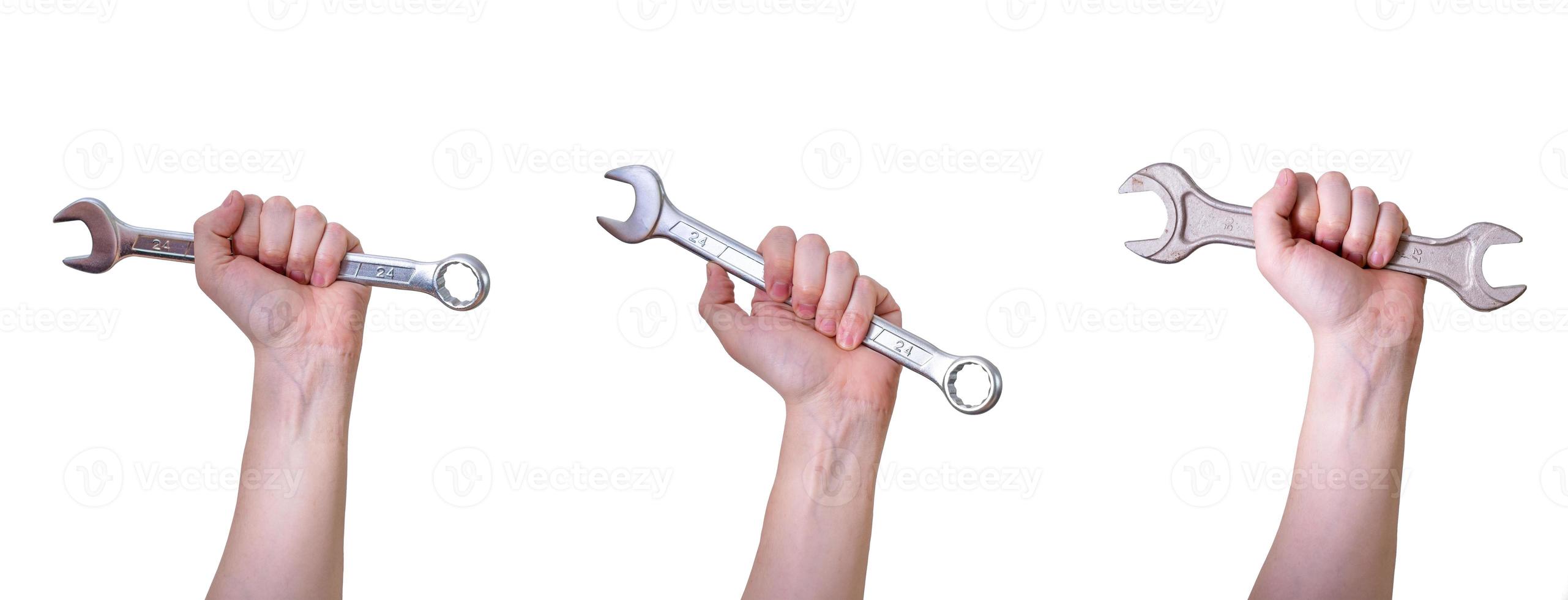 A collage of hands with wrenches on a white background. photo