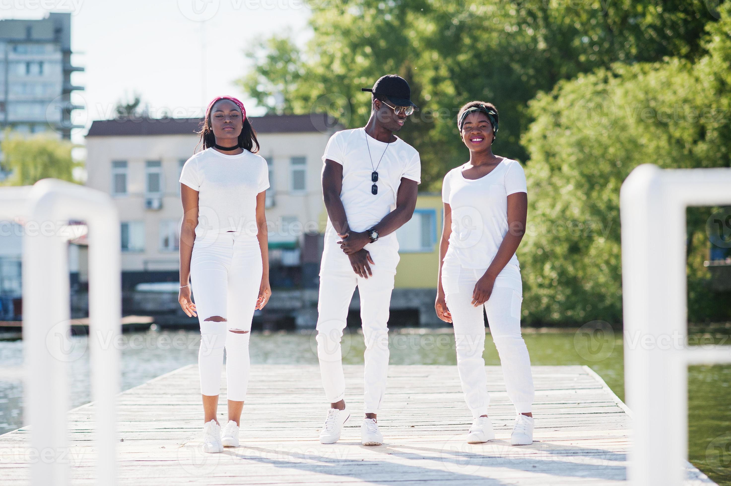 Three stylish african american friends, wear on white clothes