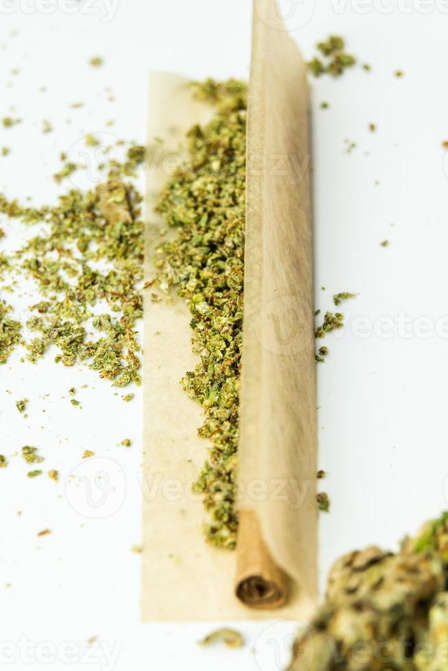 Close-up of medical marijuana buds on white background photo