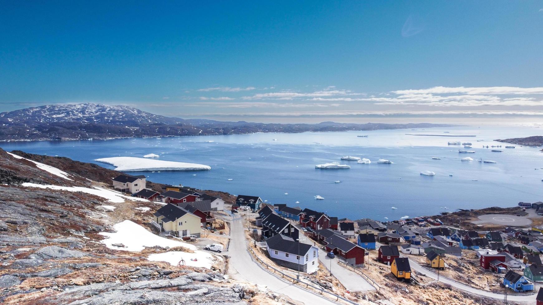 Aerial view small beautiful village over snow in Qaqortoq Greenland Europe photo