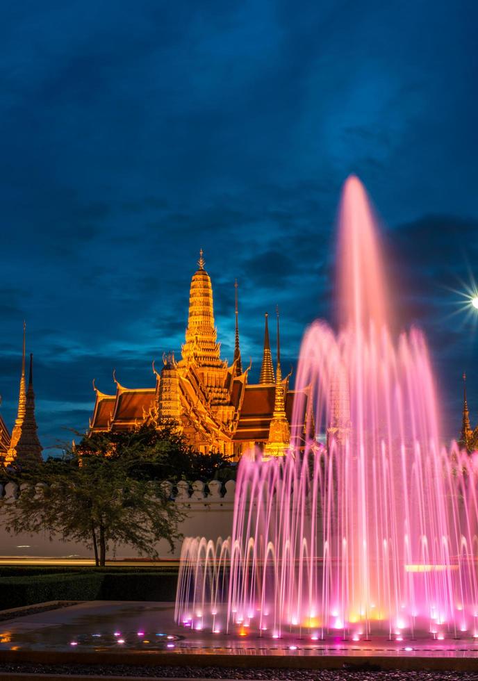 The royal palace of Thailand with showing colorful fountain at night in Bangkok the capital cities of Thailand. photo