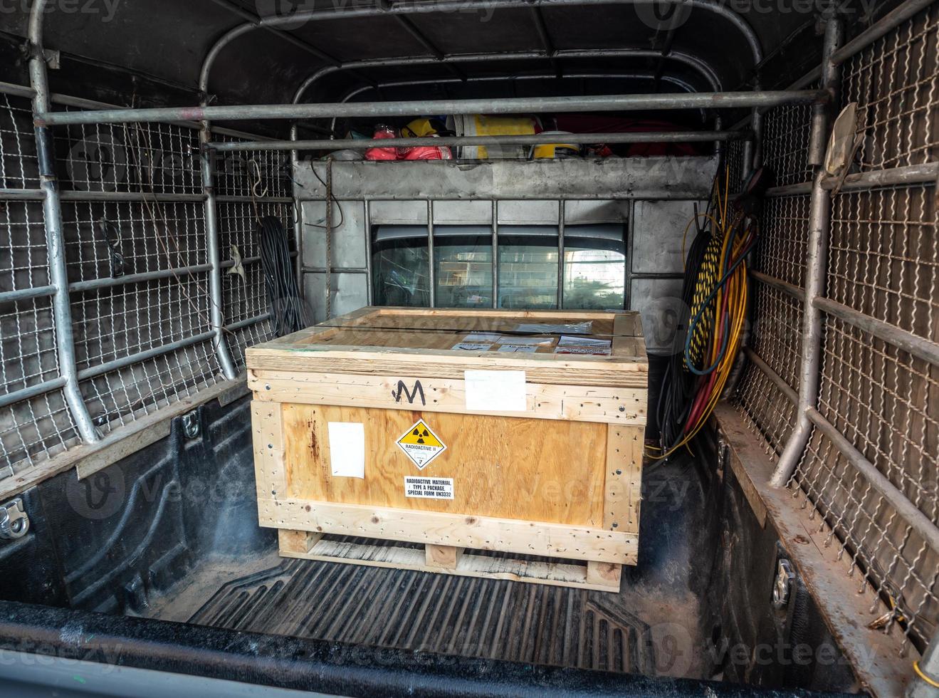 Radiation warning sign transport label Class 7 on the Dangerous goods package type A in the container of transport truck photo