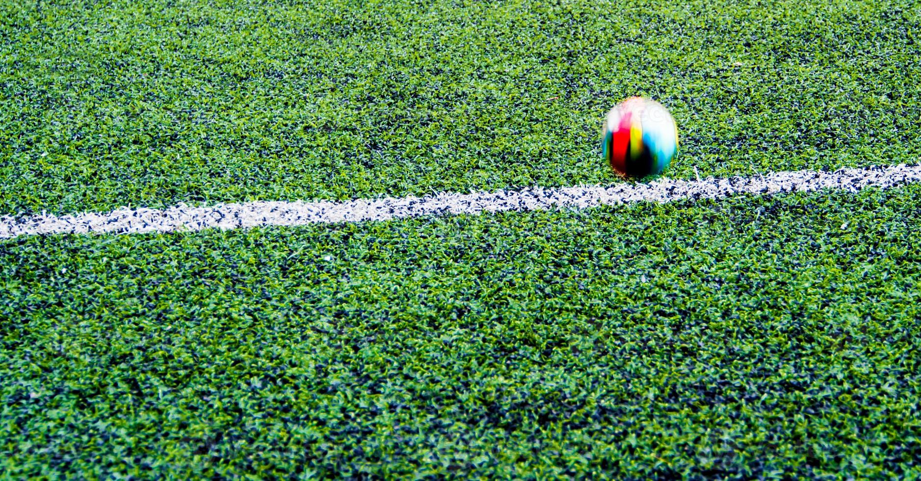 ball in the artificial turf of the school photo