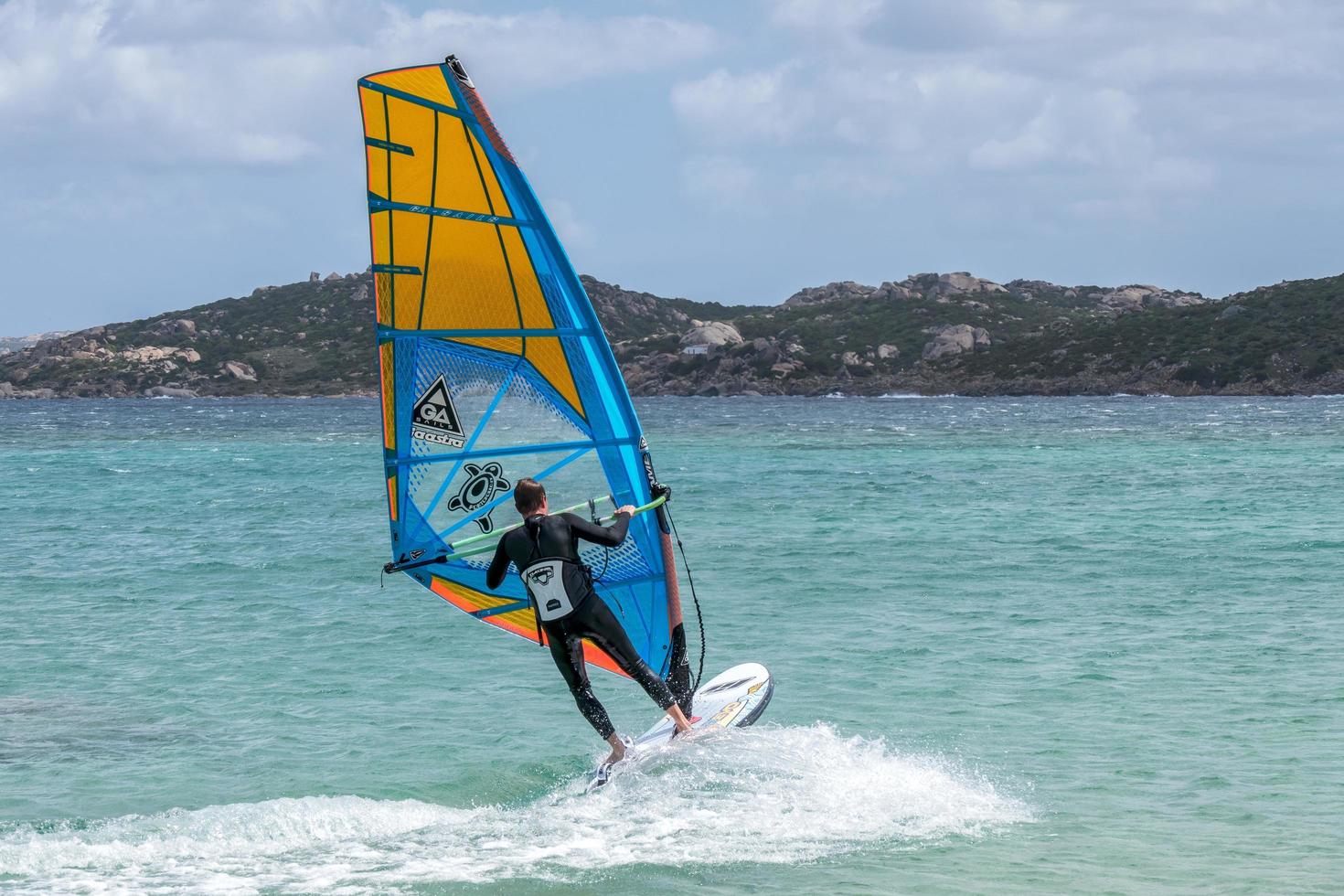 Porto Pollo, Sardinia, Italy, 2015. Windsurfing on a sunny day photo