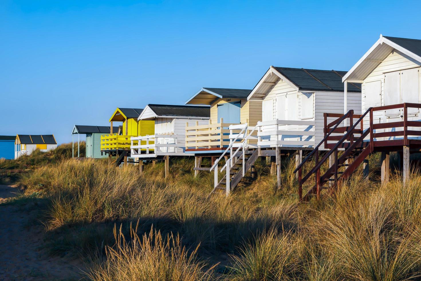 HUNSTANTON, NORFOLK, UK, 2010. Beach huts in evening sunshine photo