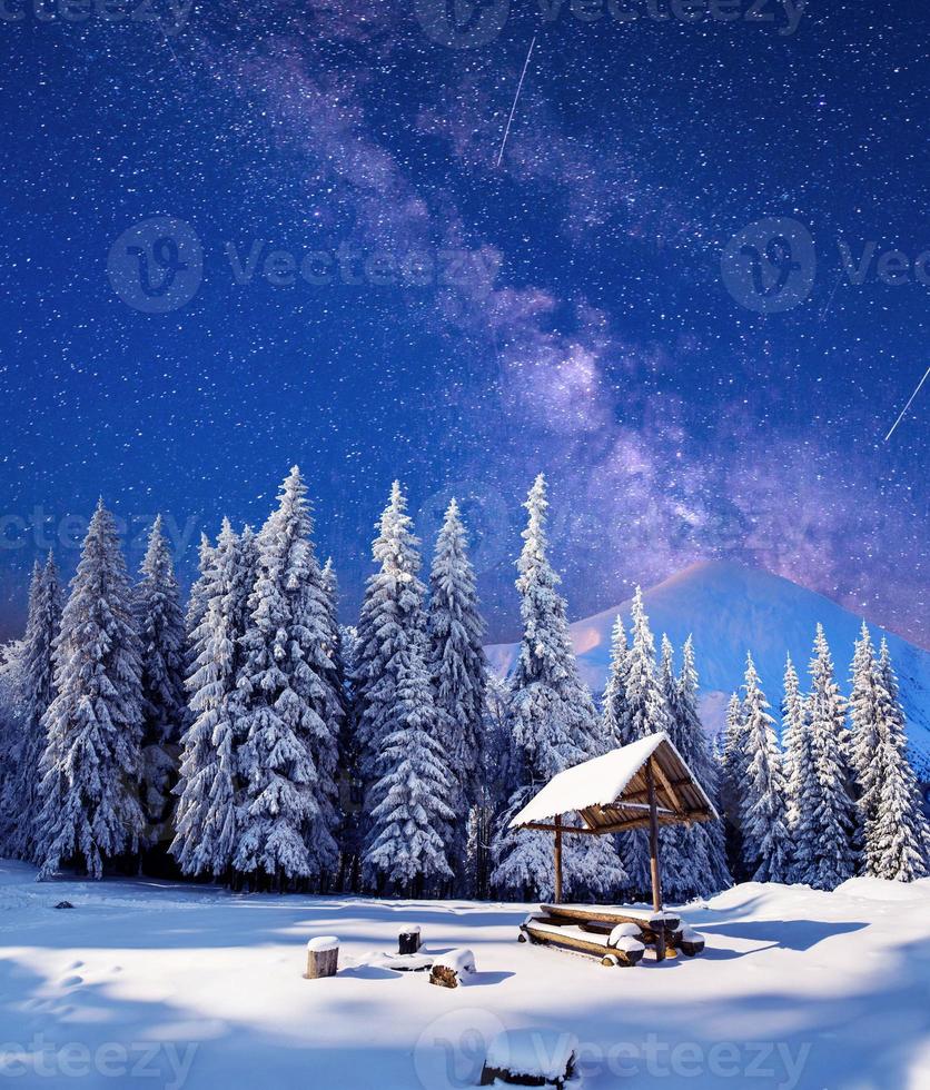 starry sky in a fantastic mountain village photo