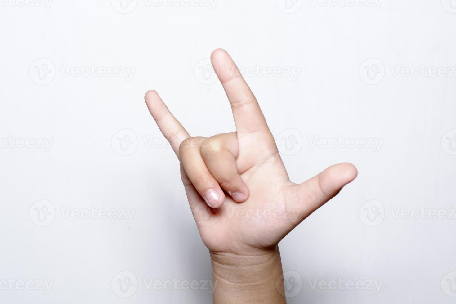 Girl raising hand show that love on white backgrounds photo