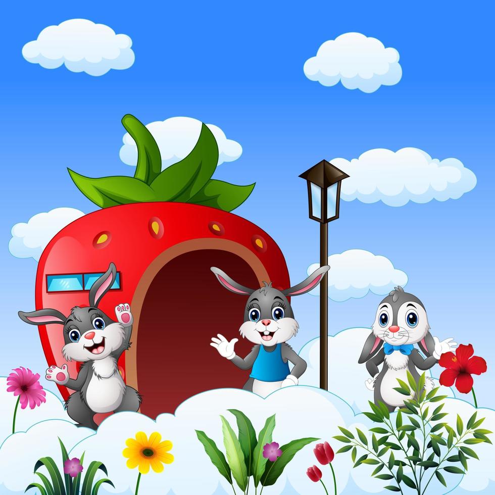 caricatura tres de conejitos frente a la casa de fresas vector