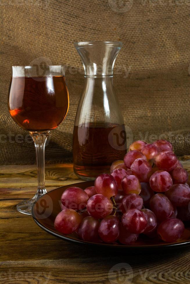 red grapes on dark wooden background photo