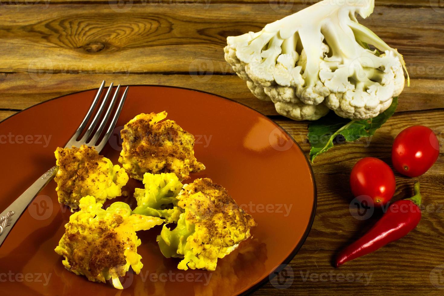 Baked cauliflower brown plate photo