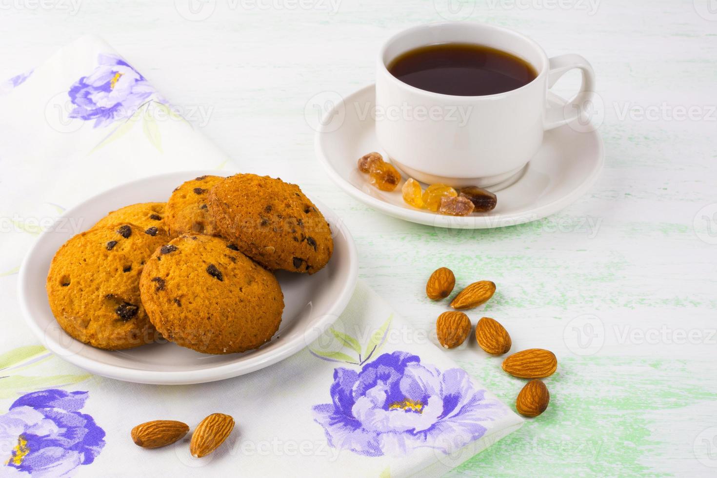 Homemade cookies,  tea cup and almond photo
