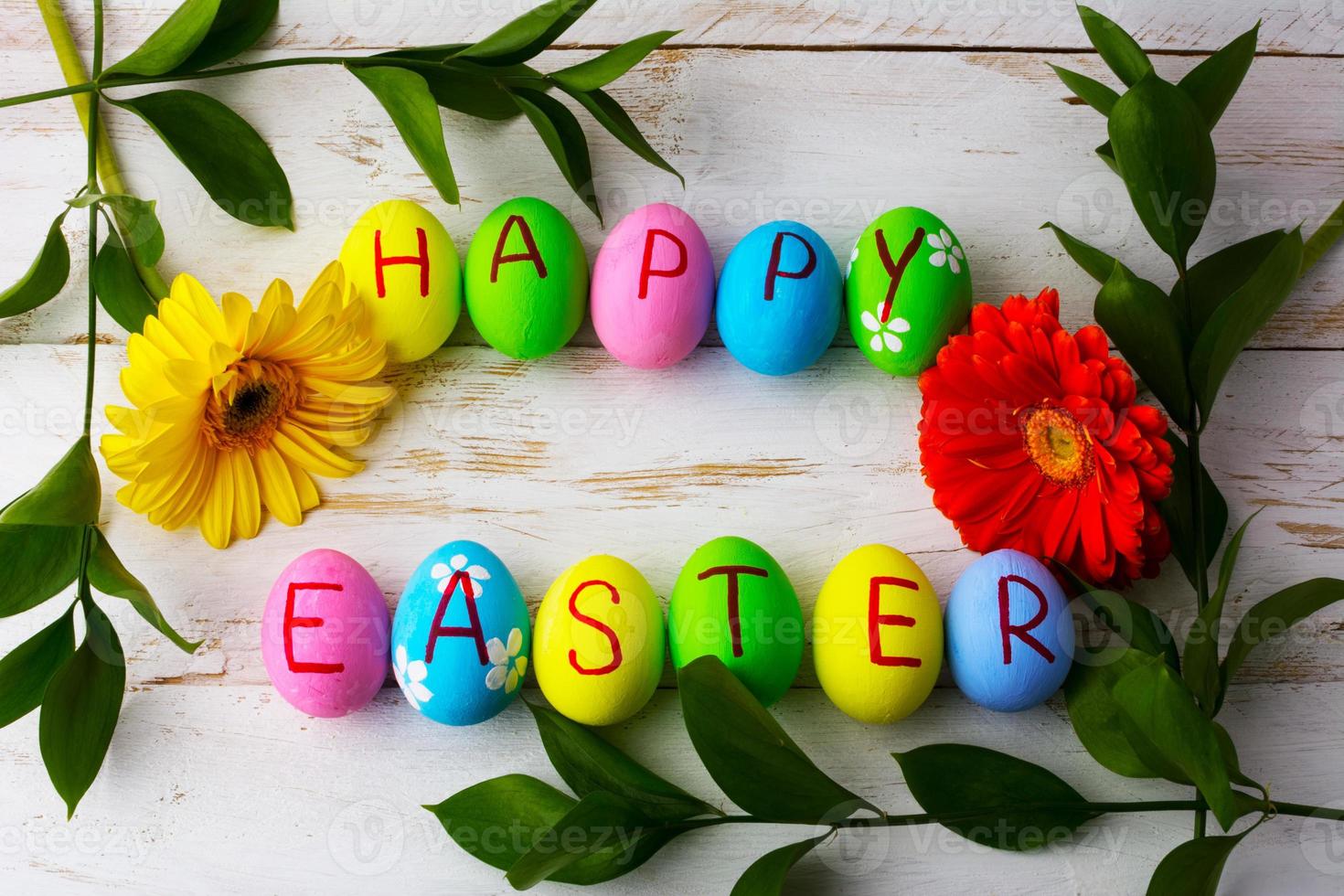 Easter eggs on a white wooden background photo