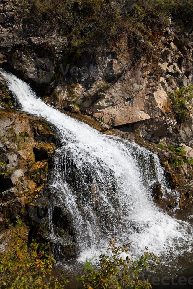 Beautiful Waterfall in the Mountains photo