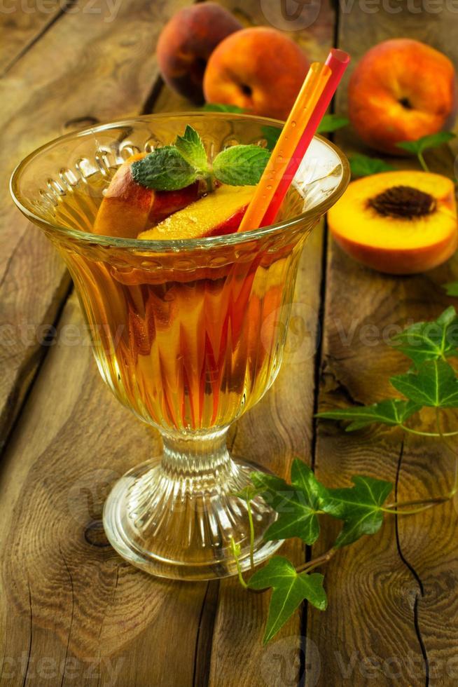 Refreshing tea with peaches photo