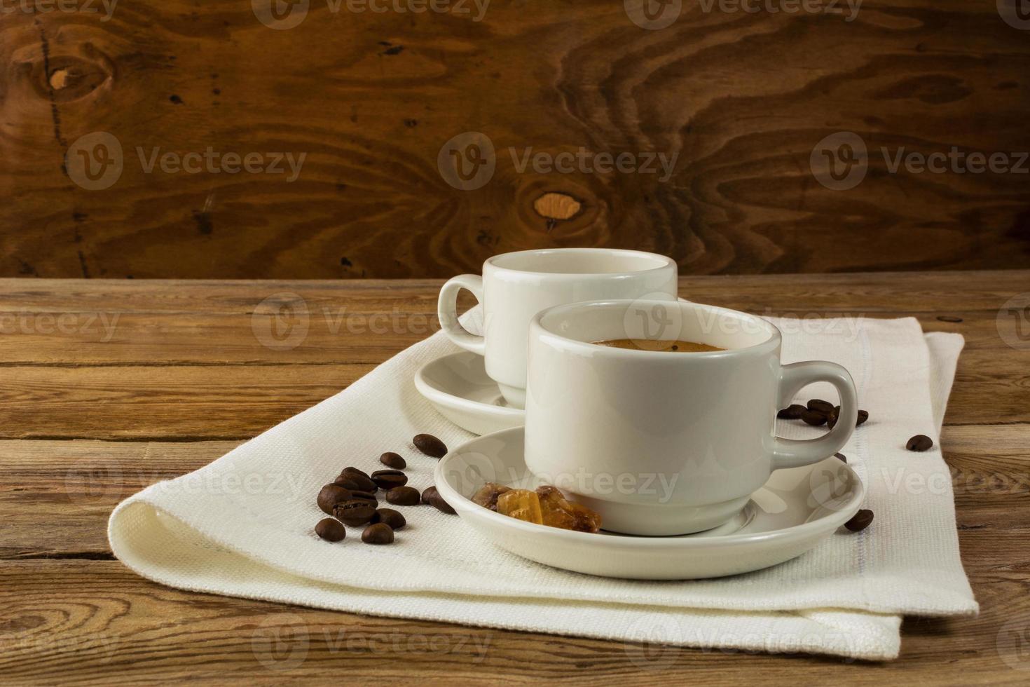 Coffee cups served on the linen napkin photo