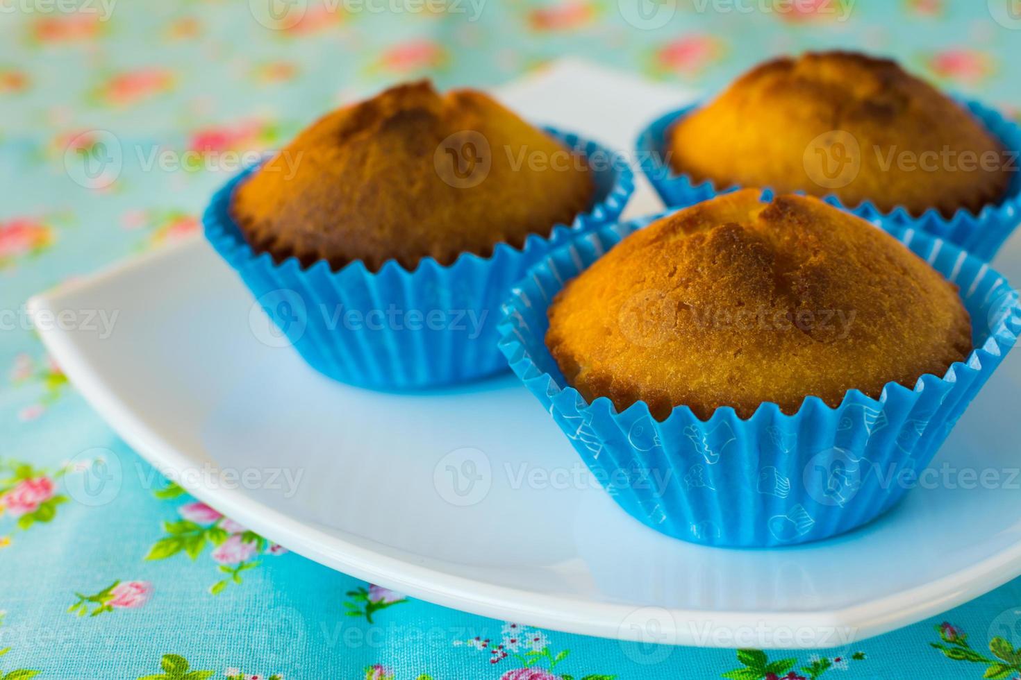 Muffins on blue background photo