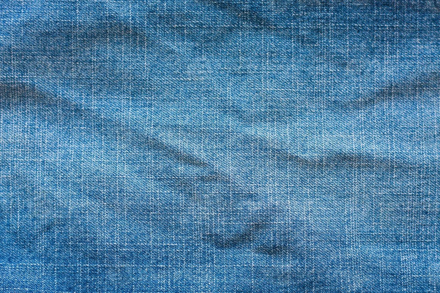 Texture of blue jeans photo