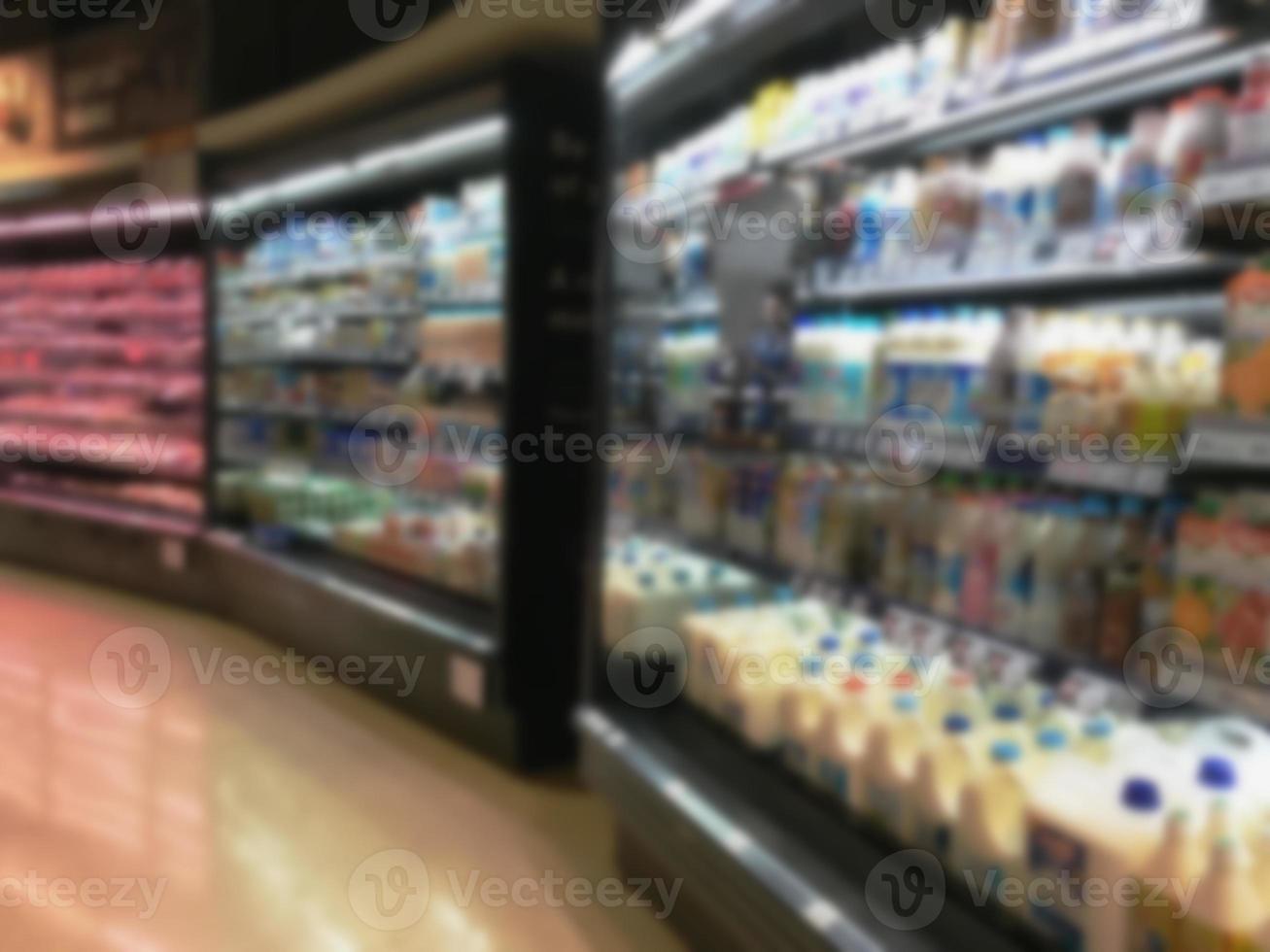 Selection of yogurts, soy milk and milk on the shelves in a supermarket photo