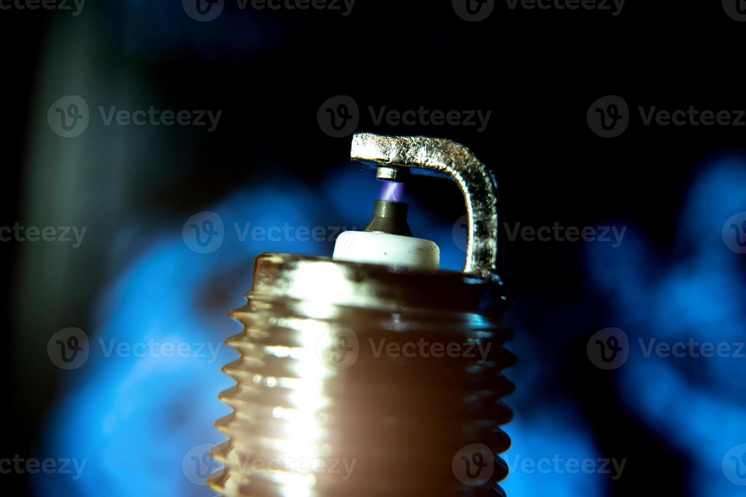 macro photo of a spark plug in close-up on a dark background