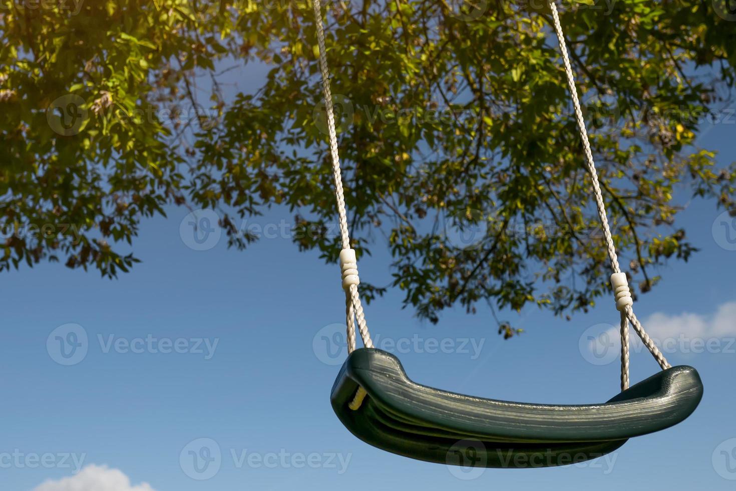 swing against the blue sky close-up photo