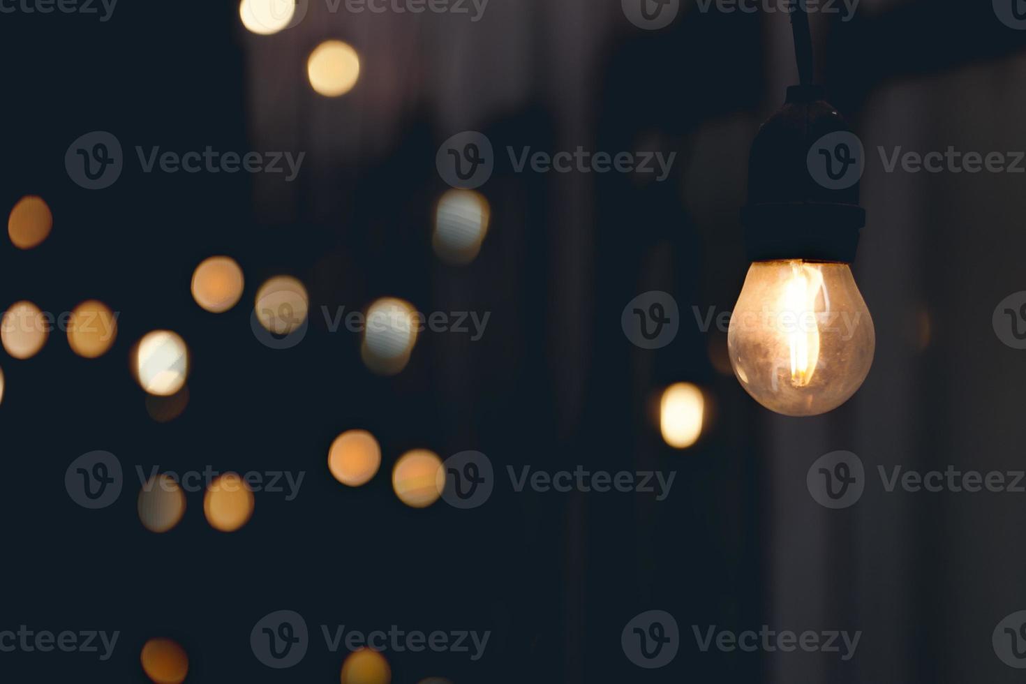 Blurry background of light bulb with copy space photo