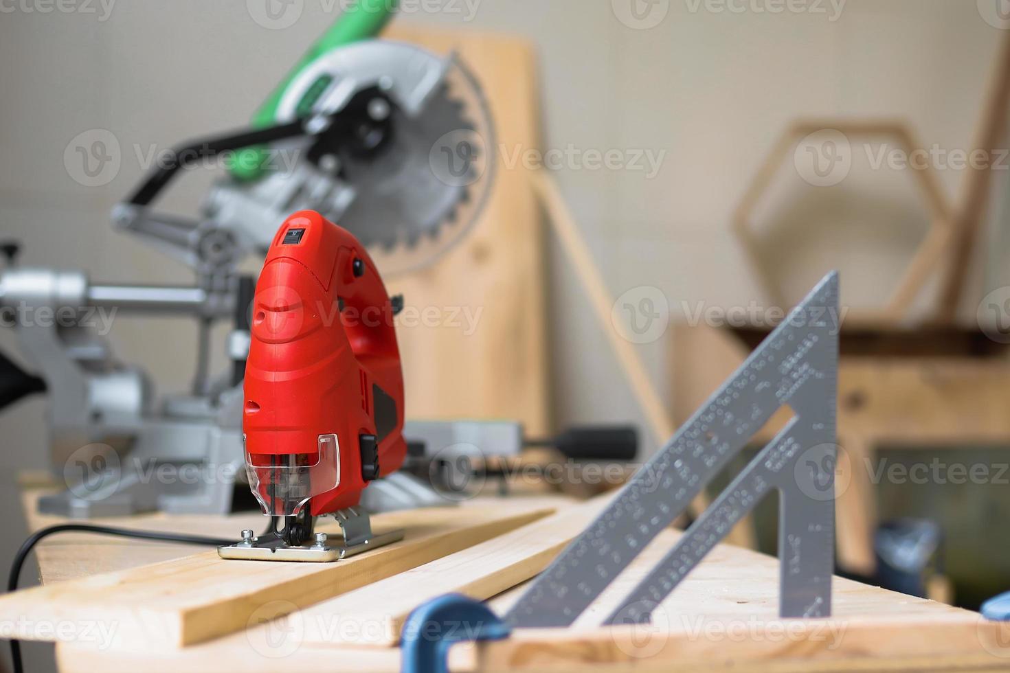 Various carpenter tools on workshop table photo