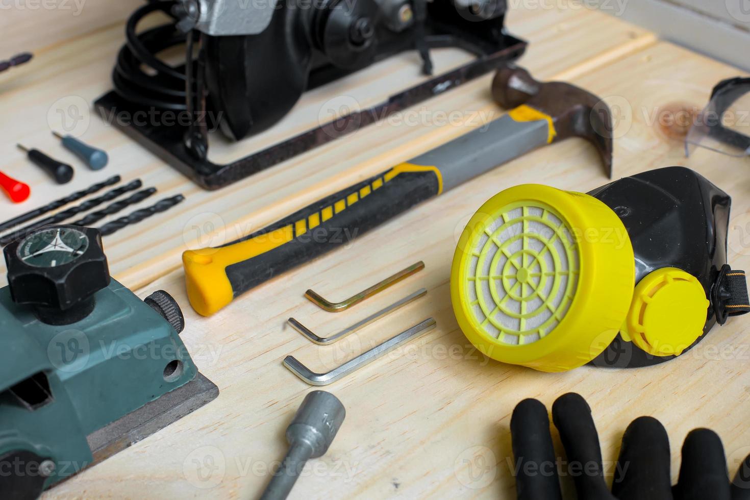 Creative flat lay composition of various carpenter tools on wooden table photo