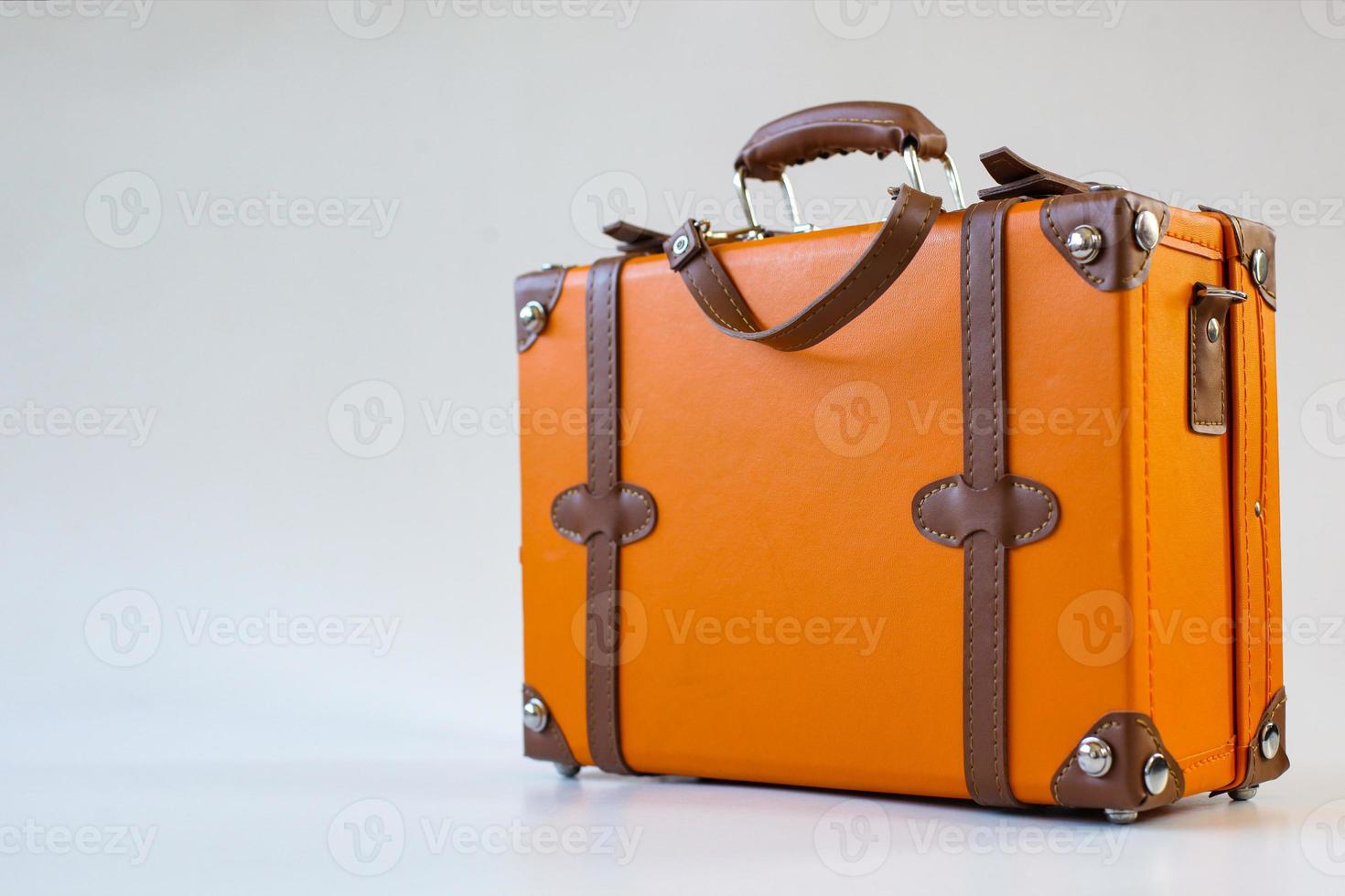 Vintage leather suitcase isolated on white background photo