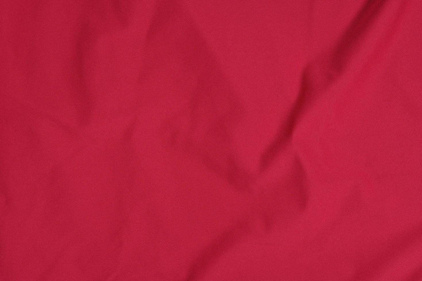 texture of red sports jersey, shirt background photo