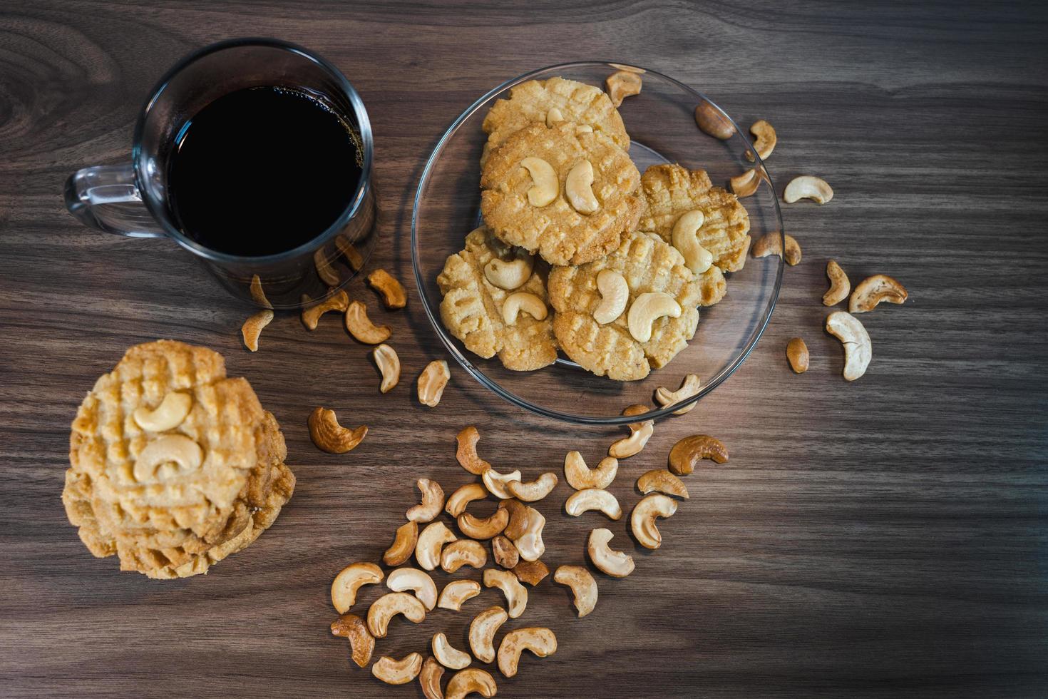 Keto cookies with coffee and cashews arranged on a wooden container photo