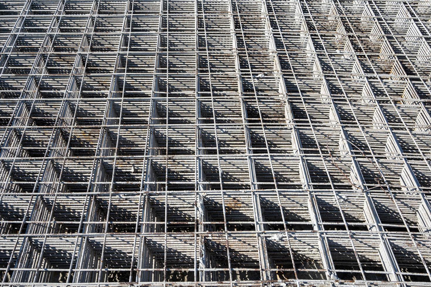 Steel grating is prepared to make cement floors for construction photo