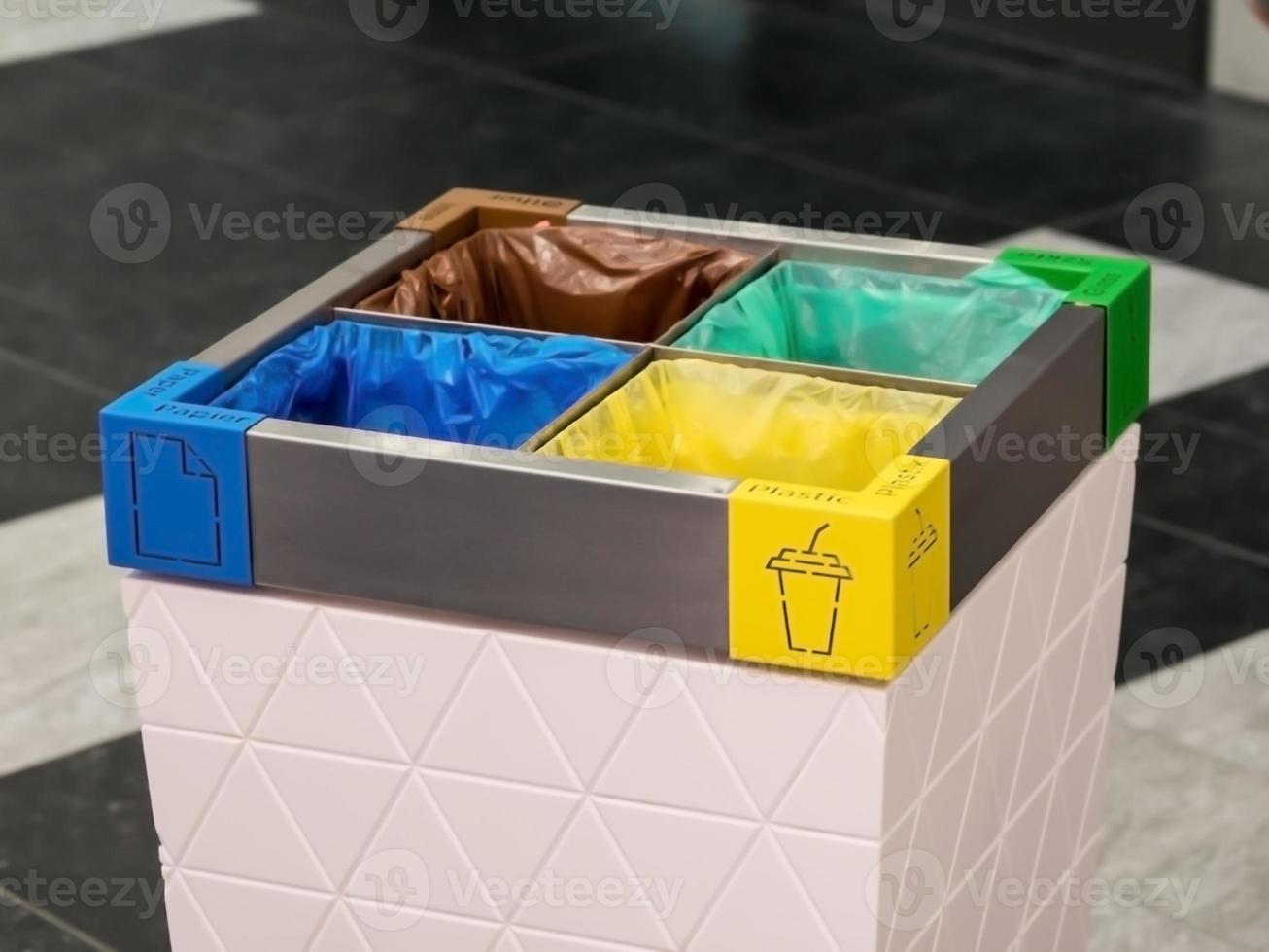 multi-colored trash can with separate garbage collection photo