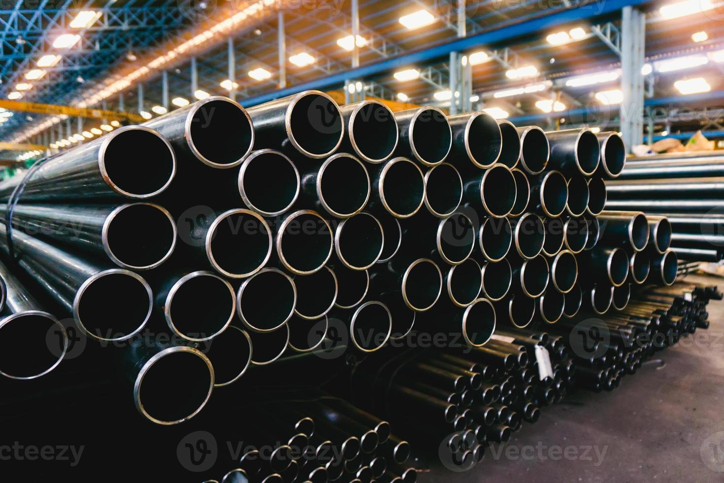 high quality Galvanized steel pipe or Aluminum and chrome stainless pipes in stack waiting for shipment  in warehouse photo