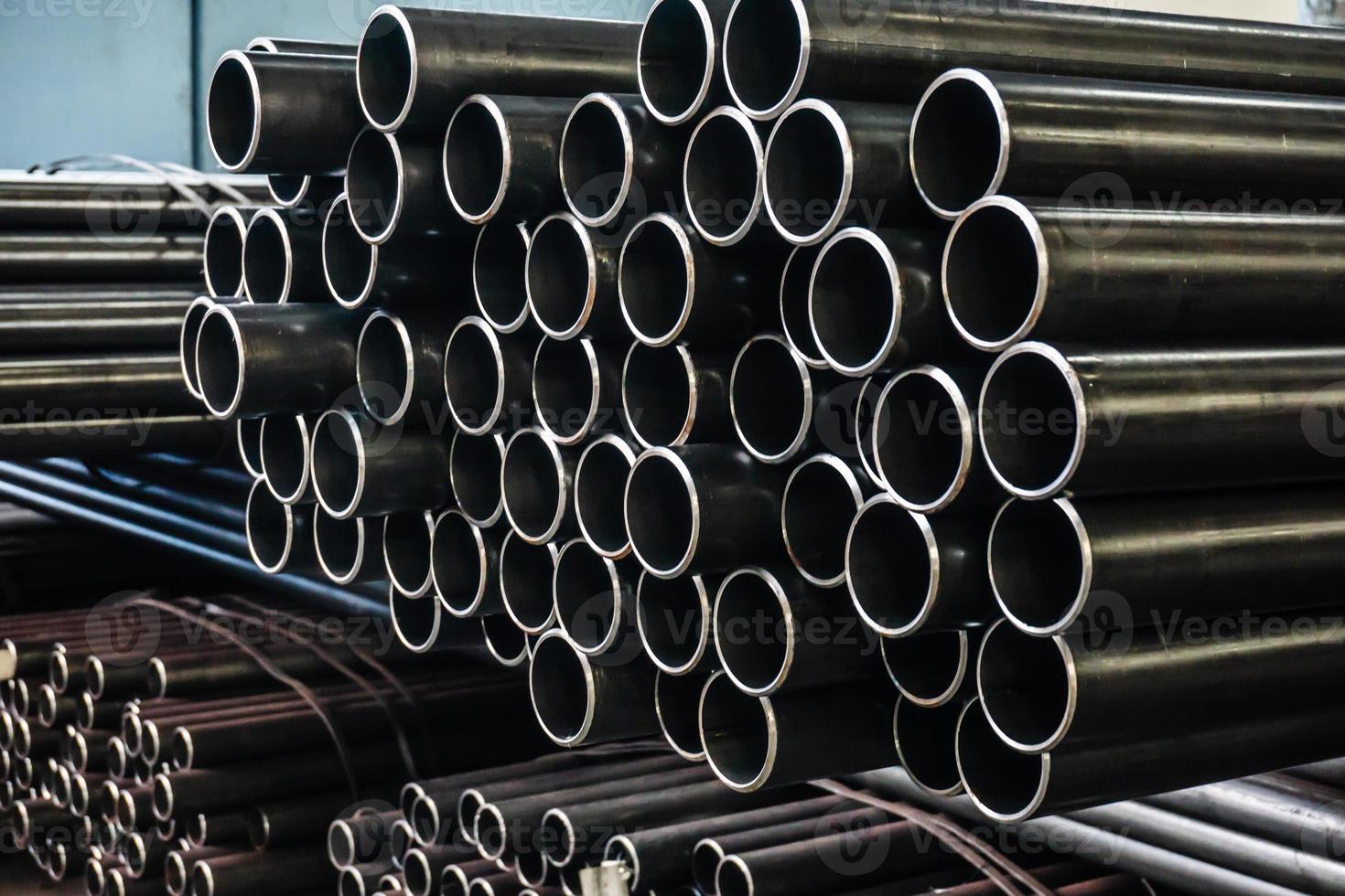 high quality Galvanized steel pipe or Aluminum and chrome stainless pipes in stack waiting for shipment  in warehouse photo