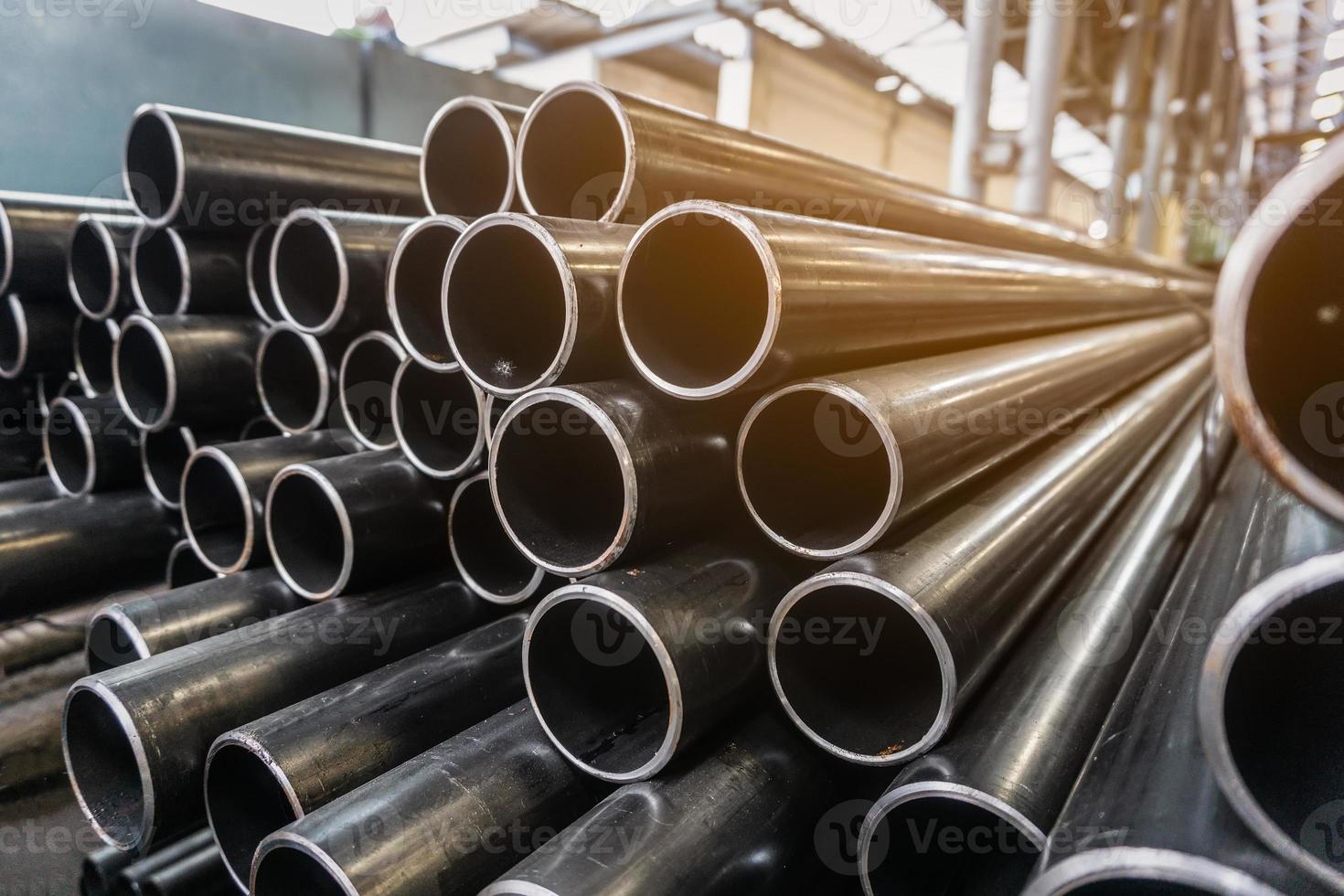 high quality Galvanized steel pipe or Aluminum and chrome stainless pipes in stack waiting for shipment  in warehouse photo