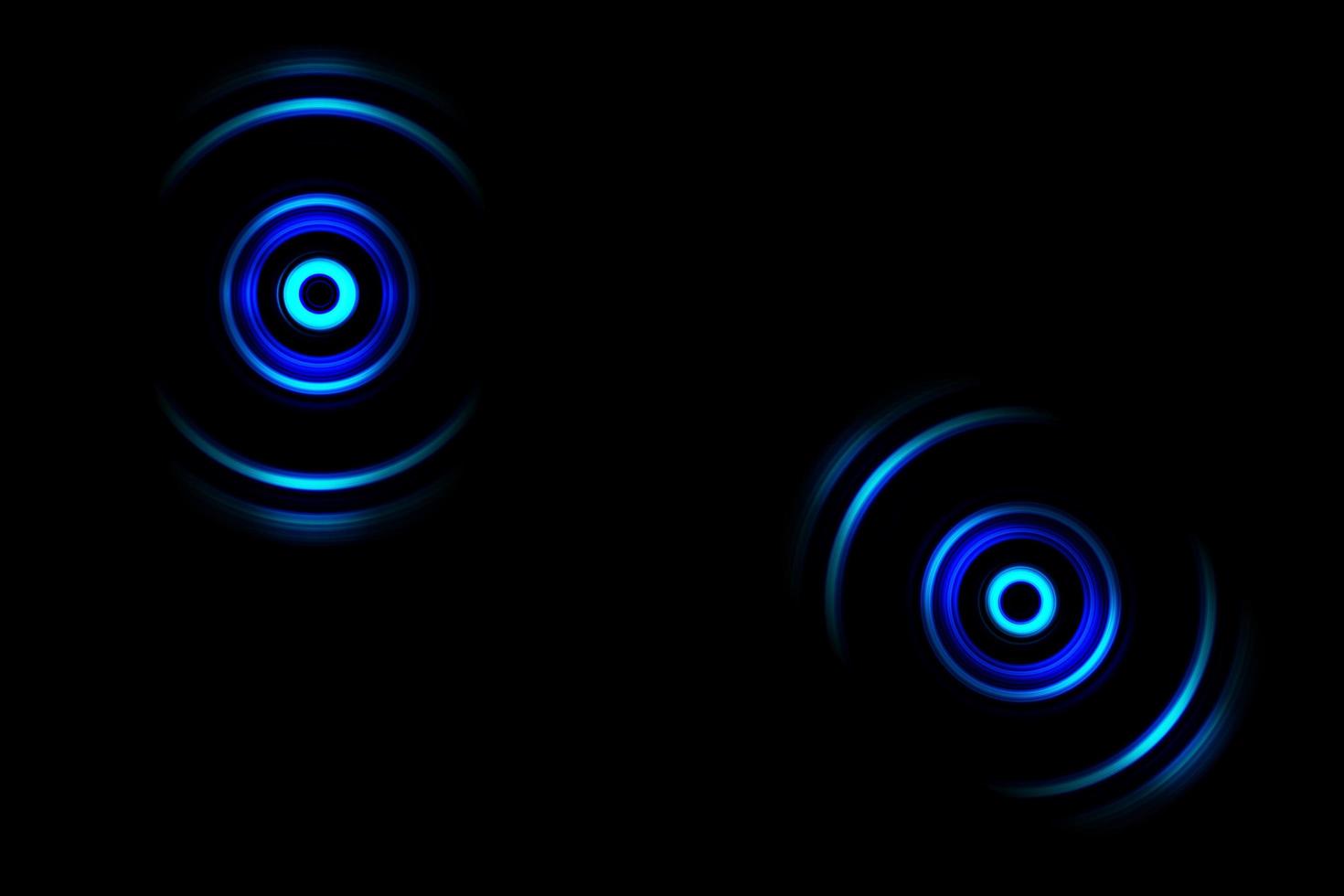 Abstract glowing circle blue light effect on black background photo