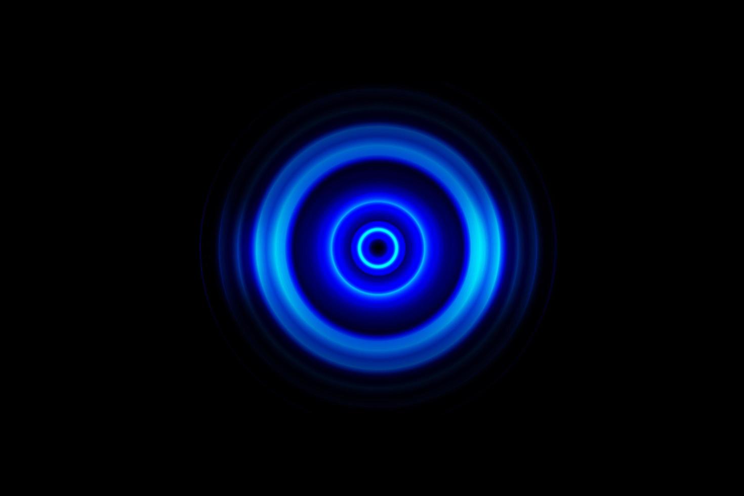 Abstract glowing circle blue light effect on black background photo