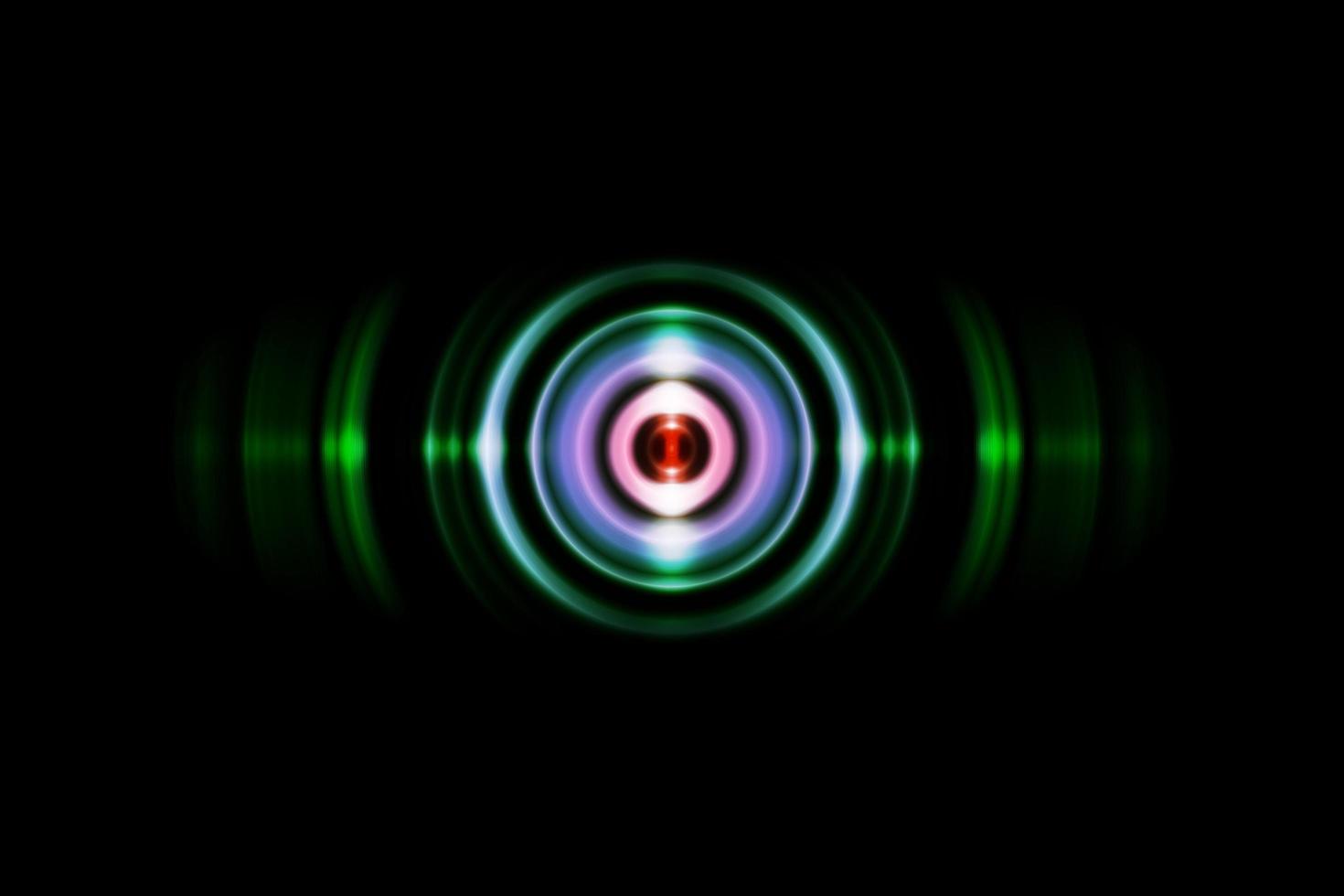 Abstract green ring with sound waves oscillating background photo