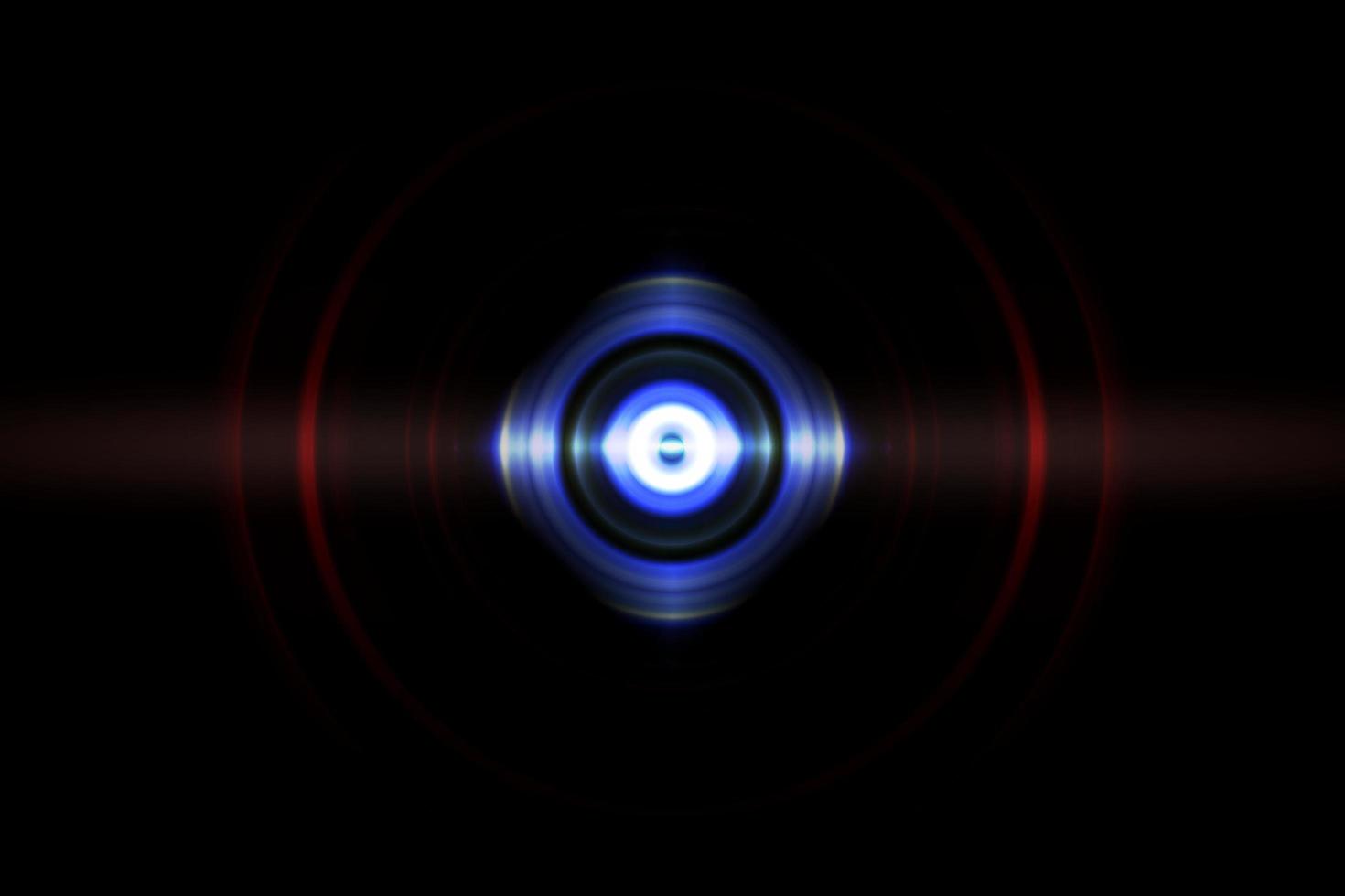 Abstract glowing circle blue light effect on black background photo