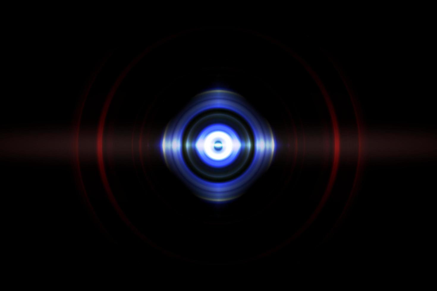 Abstract glowing circle blue light effect on black background photo