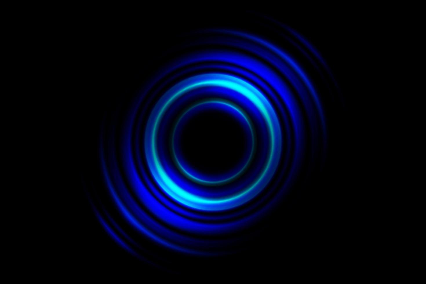 Abstract glowing circle blue light effect on black background photo