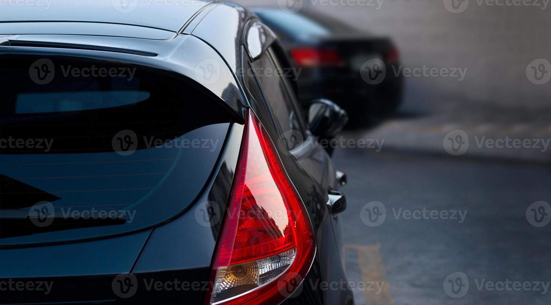 Back light of city car on the street background photo