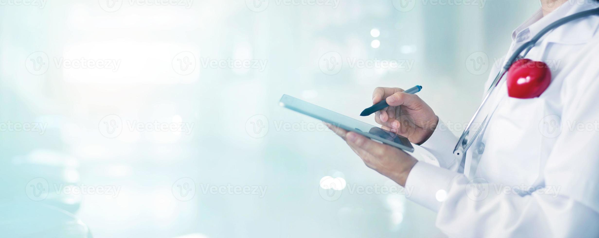 Medicine doctor and stethoscope touching medical information network connection interface on digital tablet in hospital background. Medical data and technology network concept photo