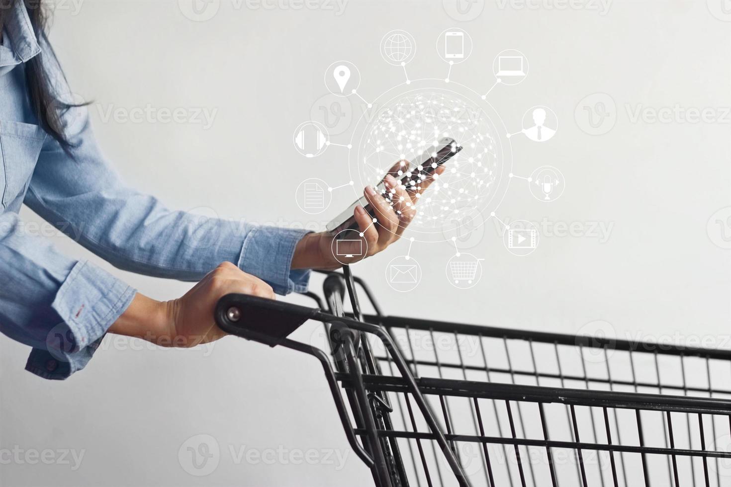 woman using mobile payments online shopping and icon customer network connection on screen, m-banking and omni channel photo