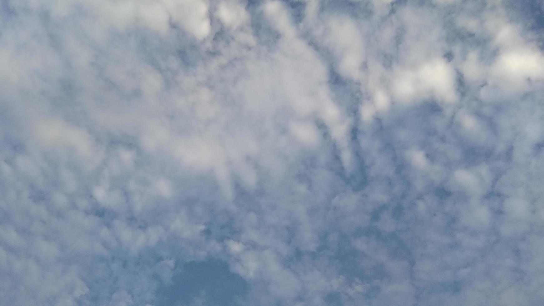 Cirrocumulus clouds in the blue sky photo