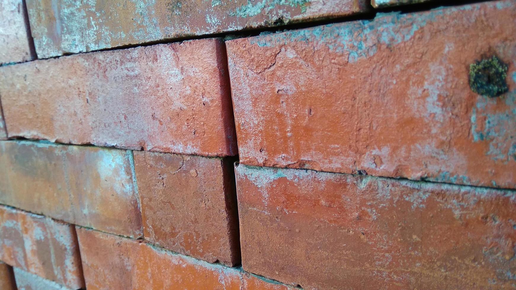 Close up view of red brick wall texture. Abstract background of a brick wall with a diminishing pattern photo