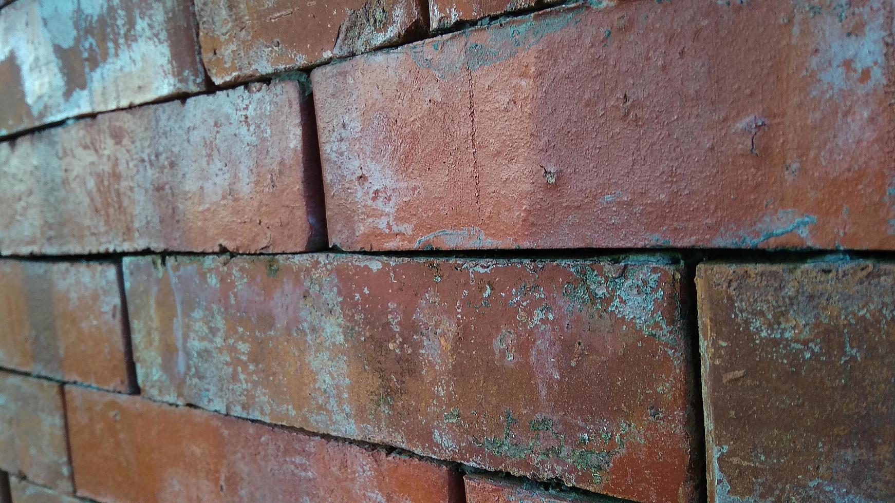 Close up view of red brick wall texture. Abstract background of a brick wall with a diminishing pattern photo