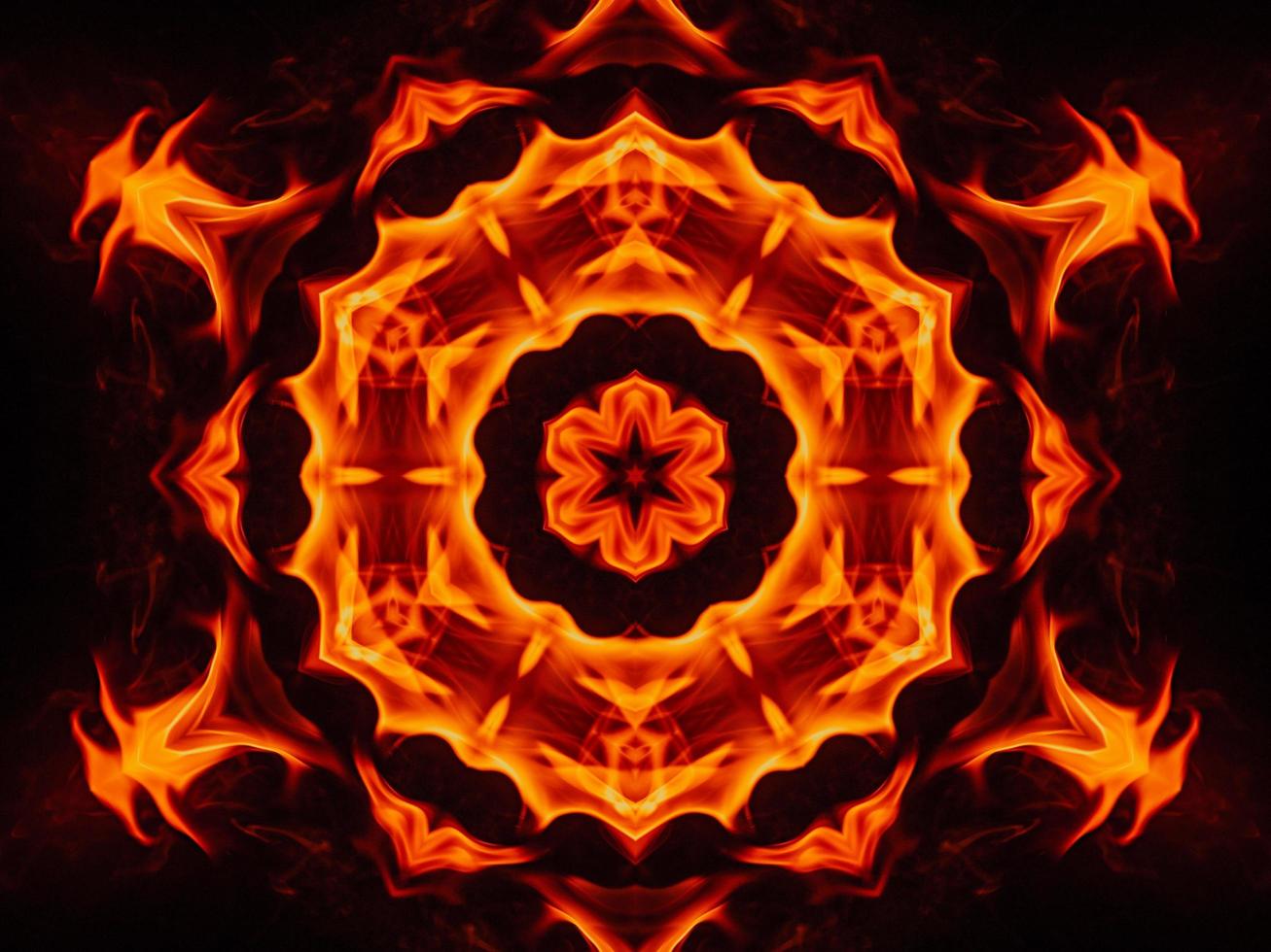 Unique abstract background. Orange flames kaleidoscope pattern. Free Photo